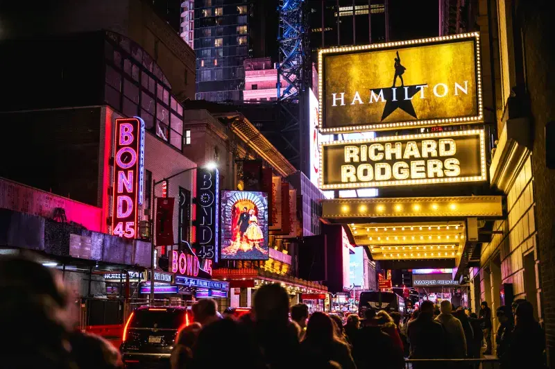 Broadway marquees illuminated at night in Times Square, Manhattan