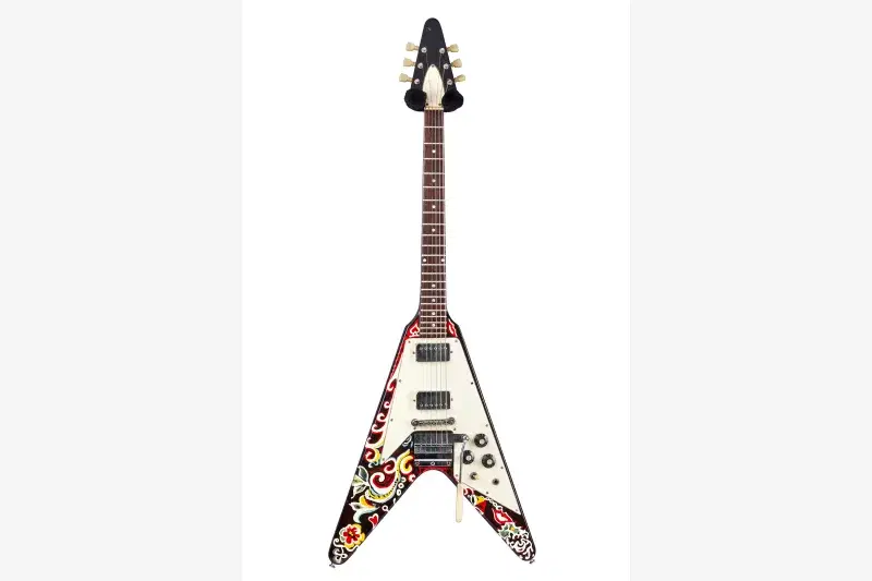 “Love Drops,” Flying V electric guitar, Gibson Guitar Corp. Originally painted by Jimi Hendrix, 1967.Collection of William C. Butler. Photo: Courtesy, Rock & Roll Hall of Fame
