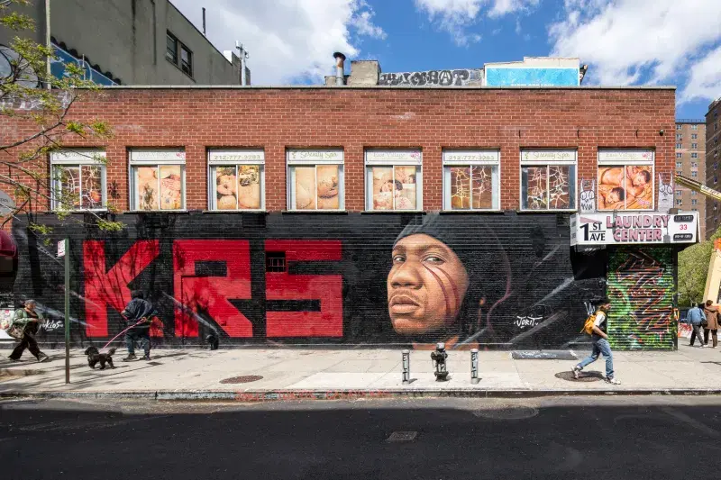 Black and Red KRS Mural on street facing wall