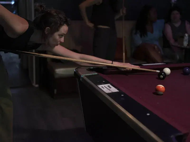 Massi, Ginger’s regular, plays pool at the bar