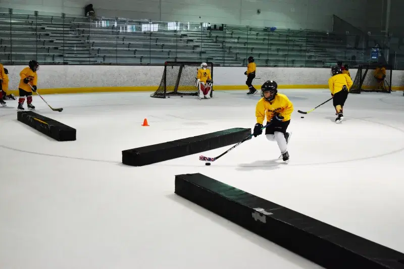 hockey players practicing and ice skating at Aviator Sports