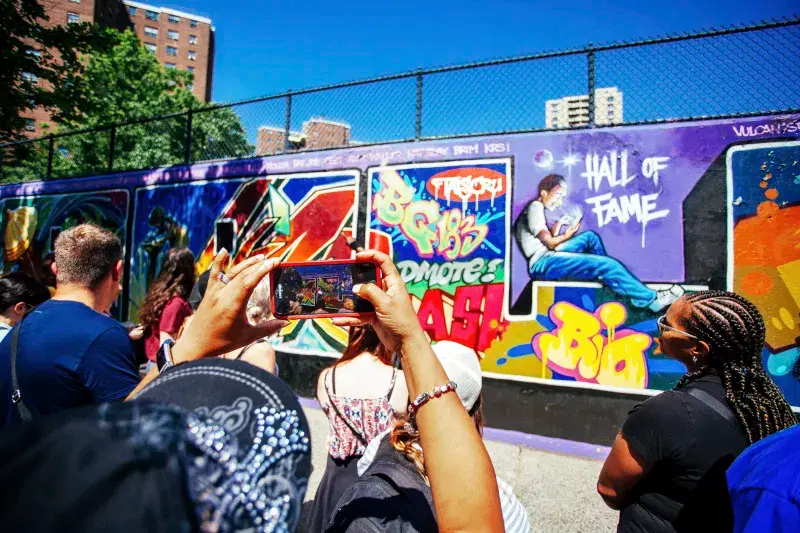 Person taking photo of Graffiti Hall of Fame