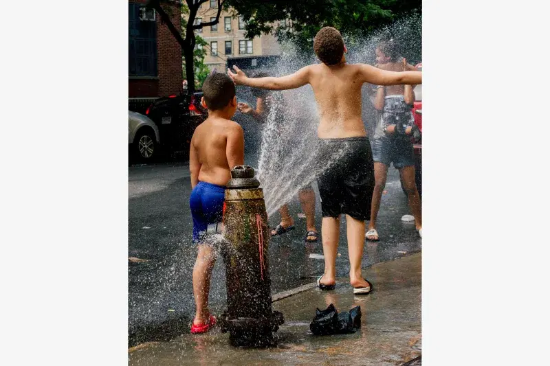 Kids running through water hydrant in the South Bronx. Photo: Maridelis Morales Rosado 