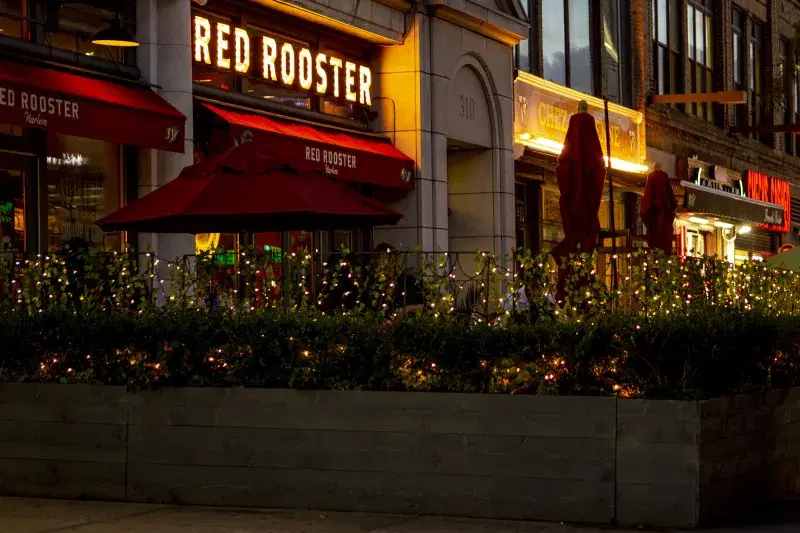 Red Rooster, exterior, at night, in Manhattan